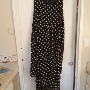 Excellent condition black and white polka dot sleeveless shark tail hem.